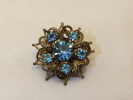Vintage Mid-Century Brooch - Floral Starburst with Blue Rhinestones and Brass Toned Filigree, Unmarked image 0